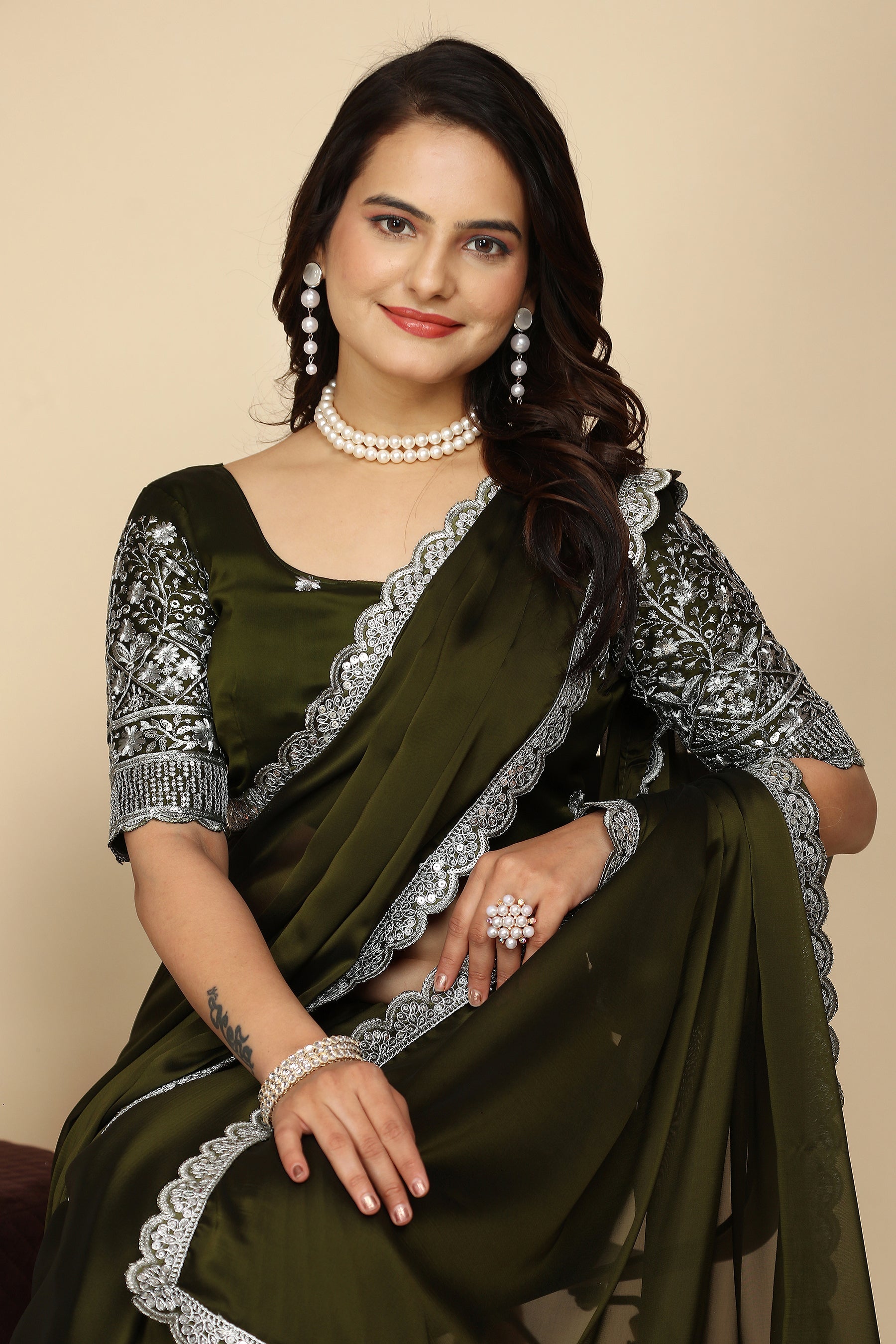 Silk Symphony: The Designer Saree That Defines Beauty in mehndi colour