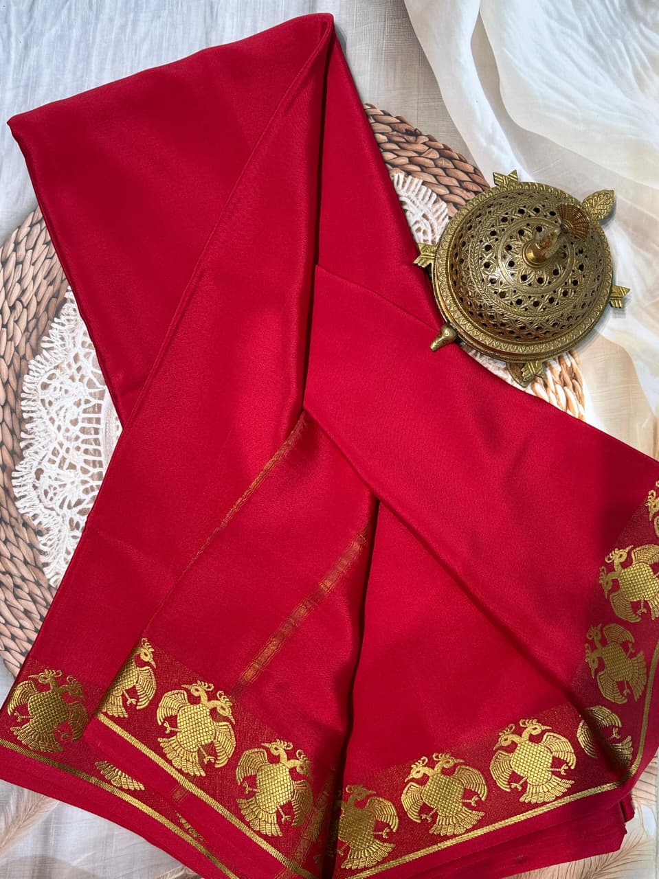 Pure Mysore Silk by Icultuers having gandaberunda border in beautiful red colour
