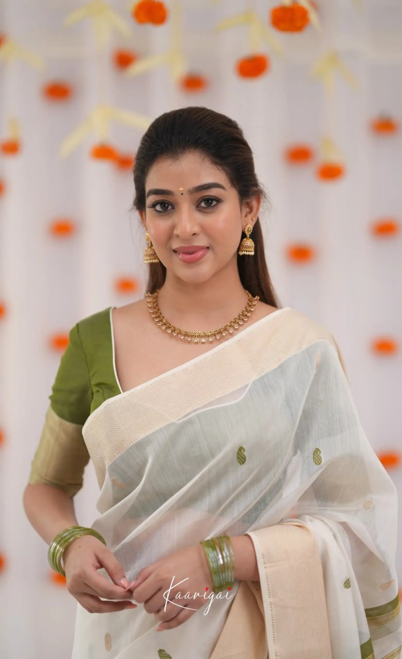 Elegant icultural White Cotton Saree with Olive Green Border – Minimal Festive Look