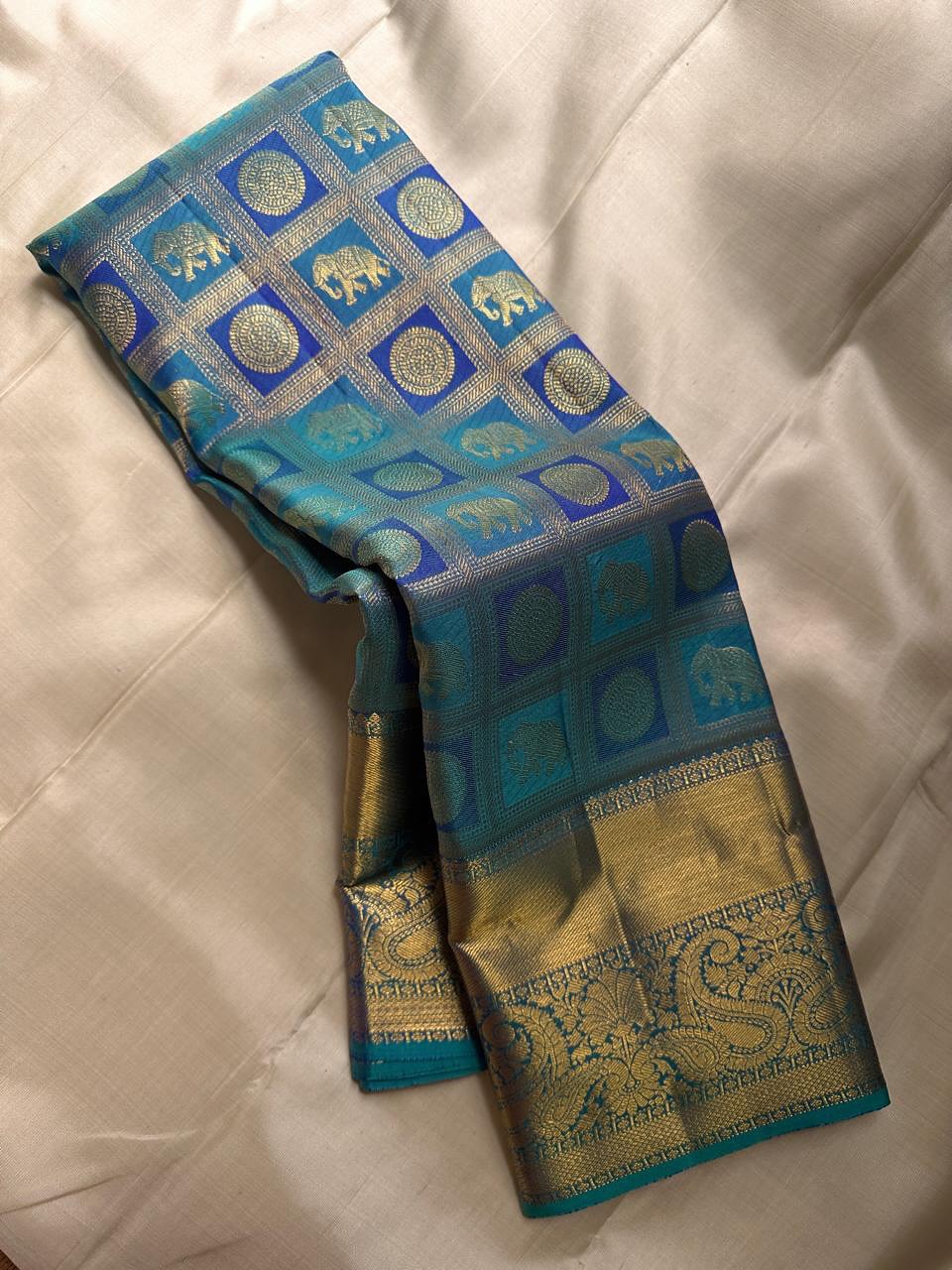 icultural Peacock icultural & Gold Kanchipuram Silk Saree with Paisley & Elephant Motifs