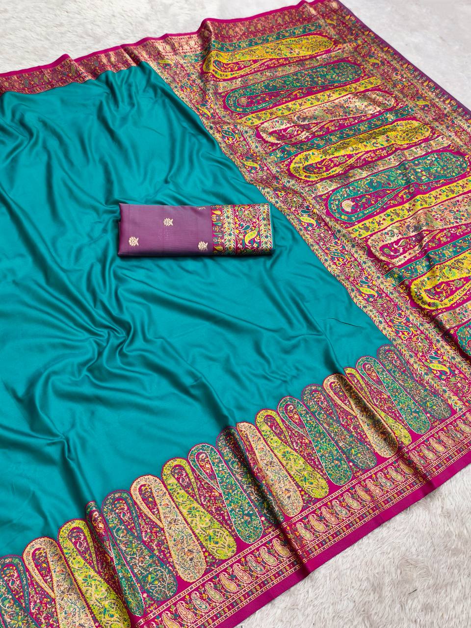 icultural Blue Satin Crepe Silk Saree with Multicolored Kani Weave & Paisley Border