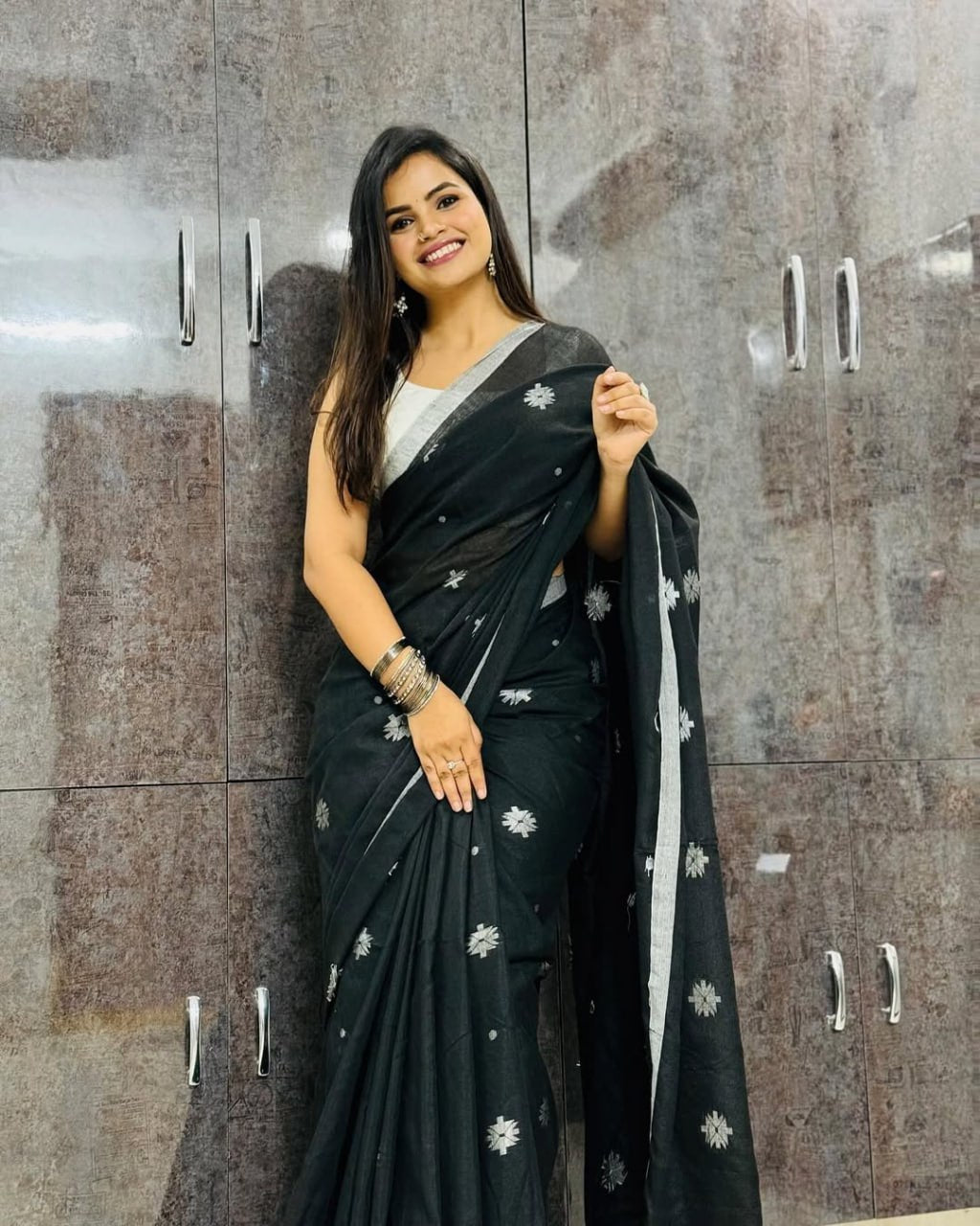 Classic Black Soft Chiffon Saree with Silver Floral Motifs and Minimal Border