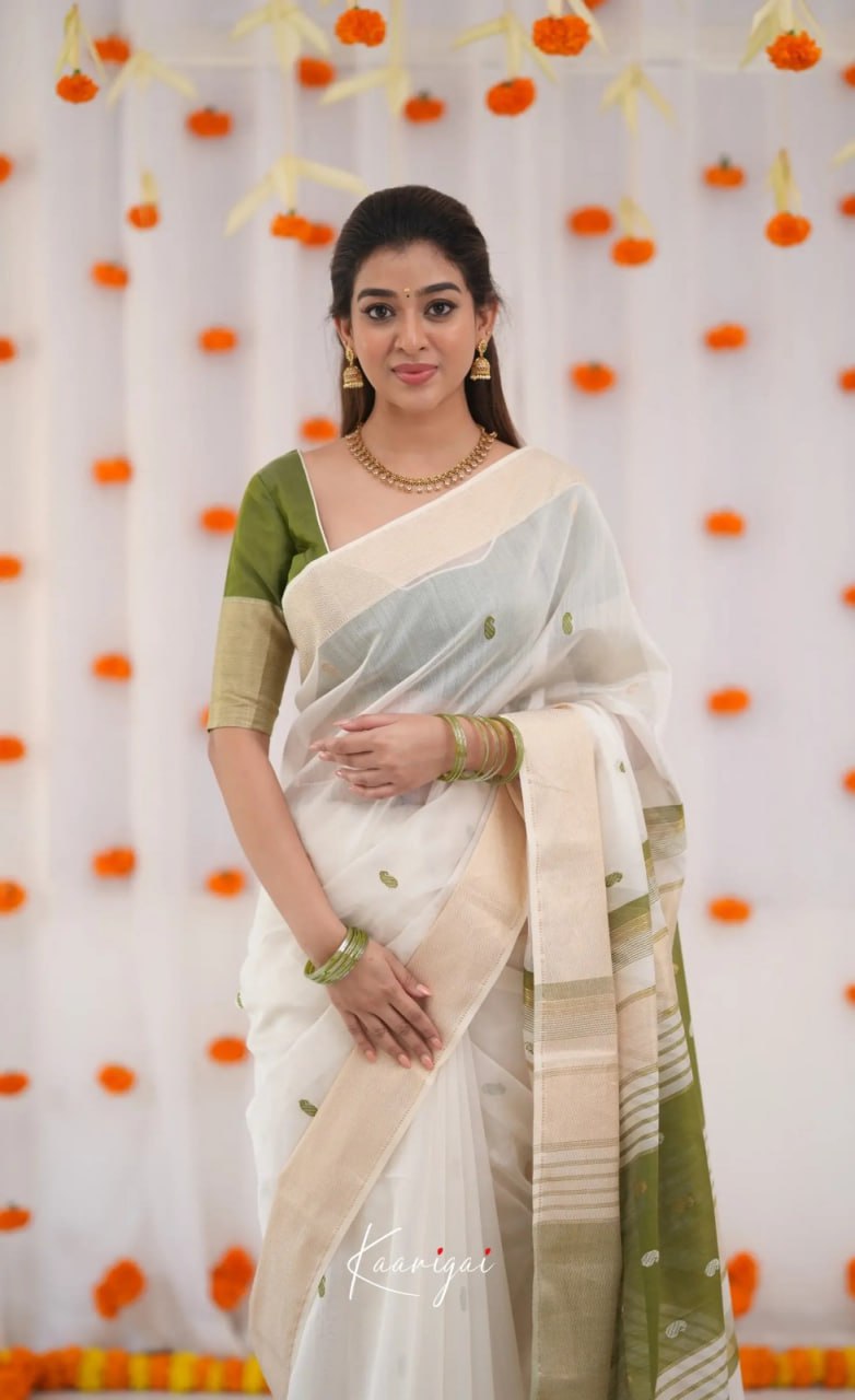 Elegant icultural White Cotton Saree with Olive Green Border – Minimal Festive Look