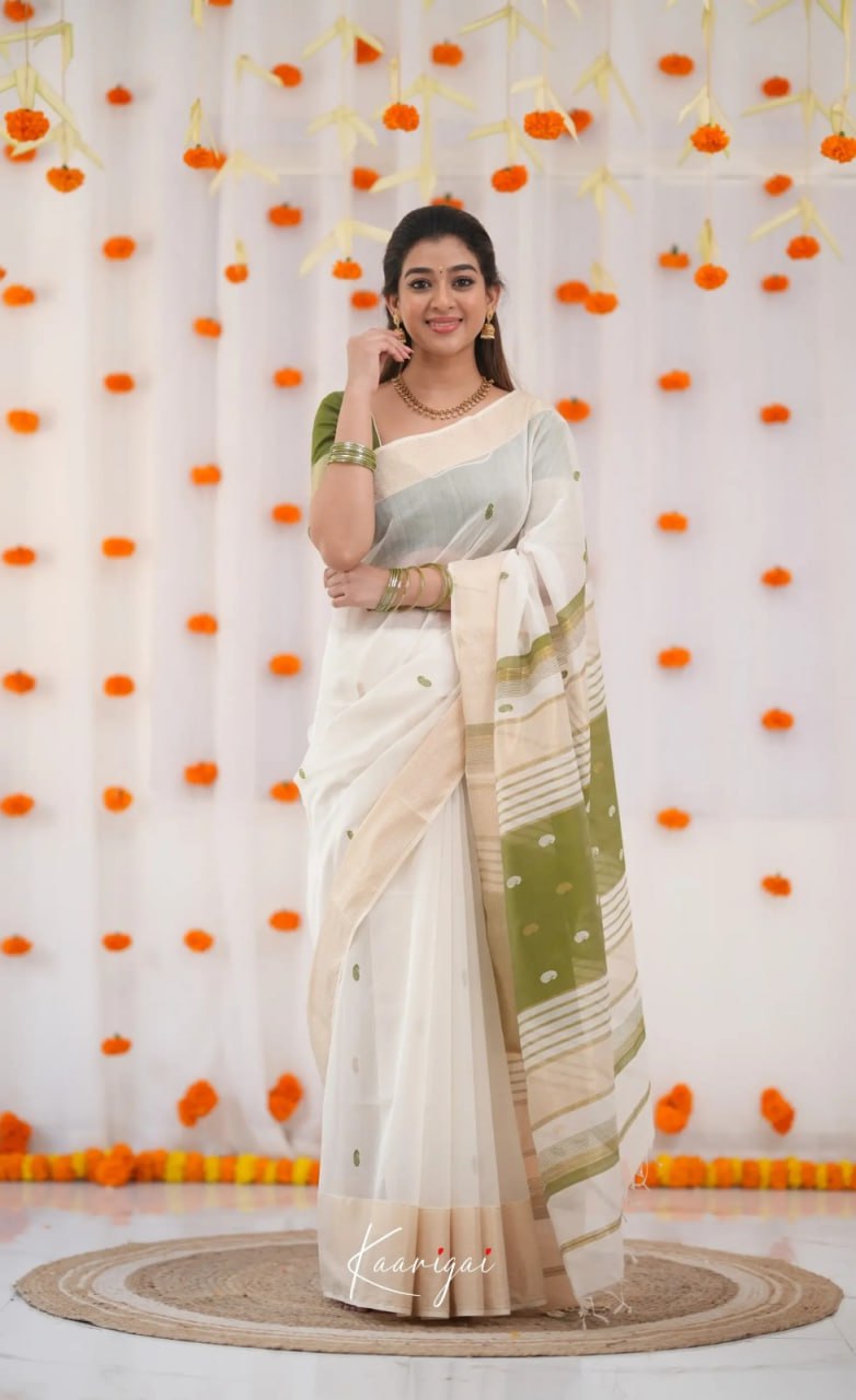 Elegant icultural White Cotton Saree with Olive Green Border – Minimal Festive Look